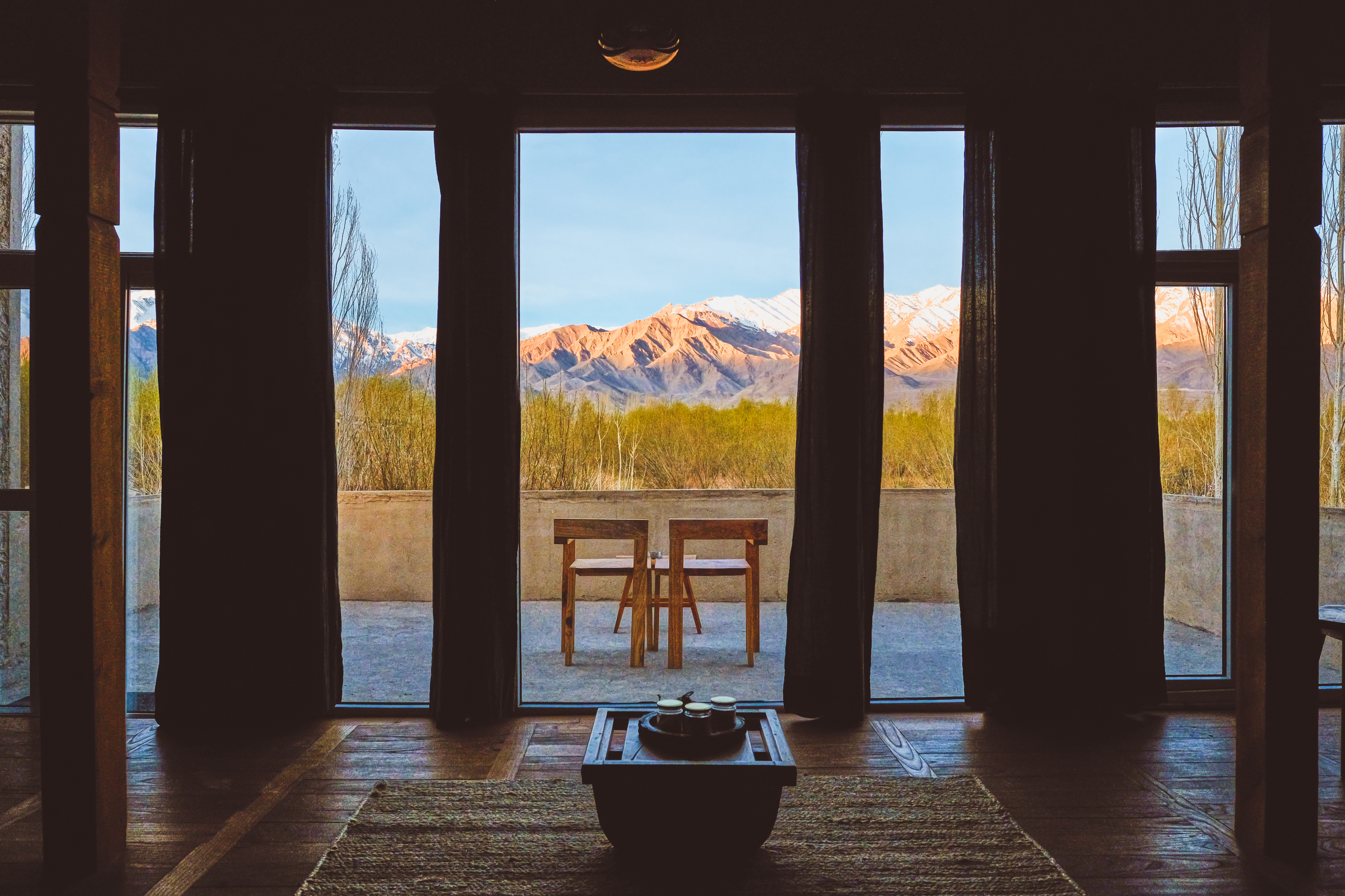 Suite interior with sun-soaked wood textures
