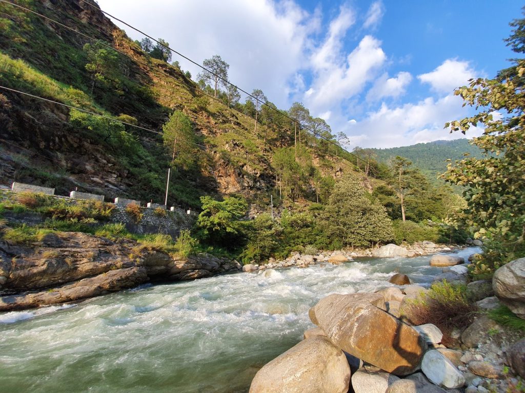 The turquoise Tirthan carves through boulder and cliff — the wildest river in Kullu